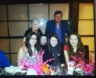 Alan, together with his wife and grandchildren
