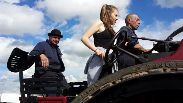 Alan, Abbi and Abbi's Dad doing what the family love, driving a vintage steam engine