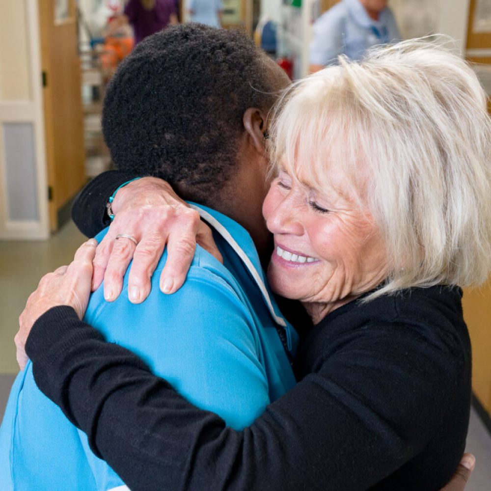 Patient and nurse hugging